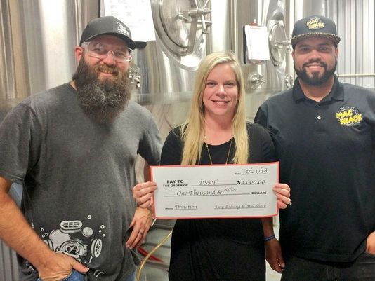 Local groups raise $1,000 for Down Syndrome Association of Tallahassee